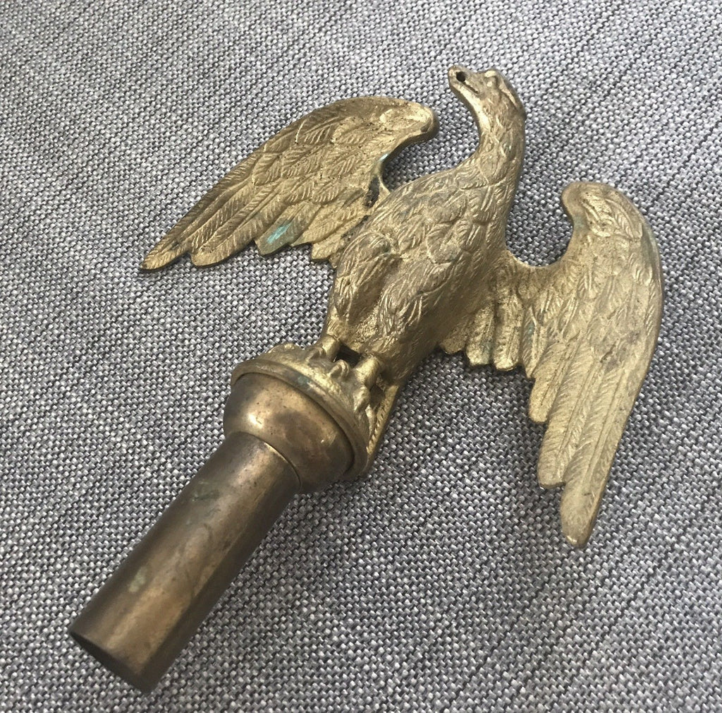 Lot - Wooden cane with brass eagle head figural cane topper and name plate.
